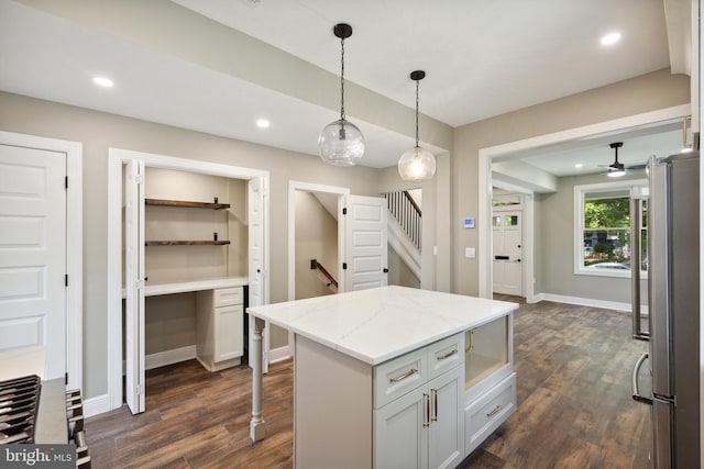 1233 Trinidad Ave NE, Washington, DC 20002 - kitchen featuring freestanding refrigerator, dark wood-style floors, a ceiling fan, hanging light fixtures, and a center island