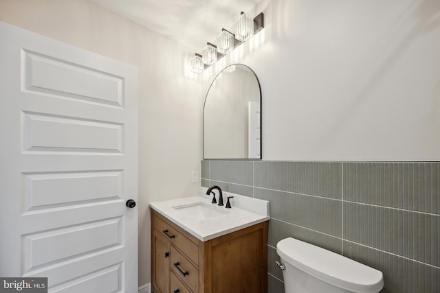 1233 Trinidad Ave NE, Washington, DC 20002 - half bath featuring vanity and tile walls