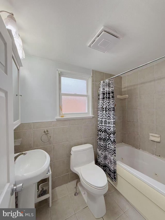 9235 Outlook Ave, Philadelphia, PA 19114 - full bath with tile walls, tile patterned flooring, shower / bath combo with shower curtain, and wainscoting