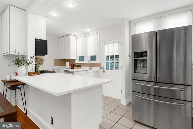 258 Pancoast Ave, Springfield, PA 19064 - kitchen with stainless steel appliances, a peninsula, white cabinetry, light countertops, and recessed lighting