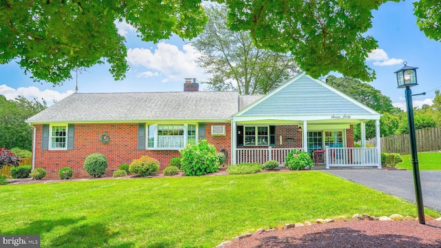 760 Sweetbriar Dr, Warminster, PA 18974 - view of front of property with brick siding, a porch, a chimney, and roof with shingles