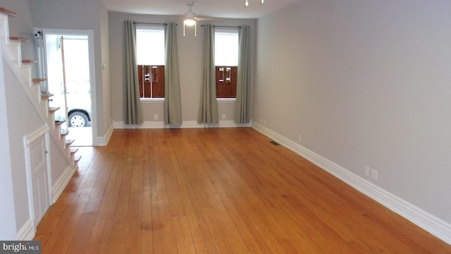 139 N 11th St, Allentown, PA 18102 - entryway with light wood-style floors, stairway, and a ceiling fan