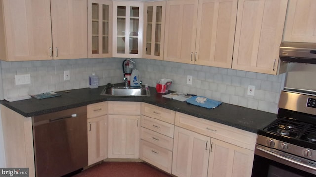 139 N 11th St, Allentown, PA 18102 - kitchen with appliances with stainless steel finishes, tasteful backsplash, glass insert cabinets, and dark countertops