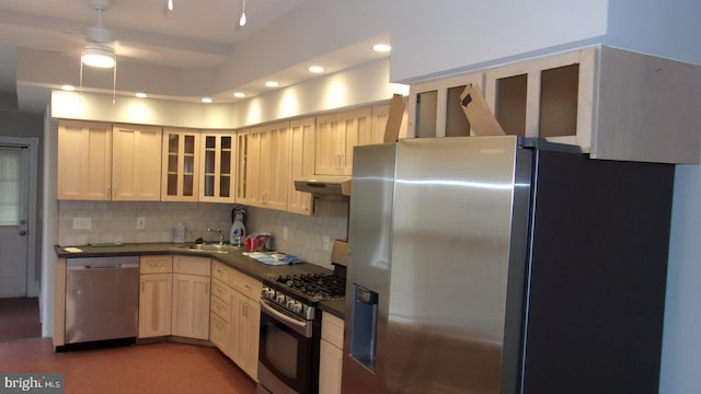 139 N 11th St, Allentown, PA 18102 - kitchen with stainless steel appliances, decorative backsplash, dark countertops, under cabinet range hood, and a ceiling fan