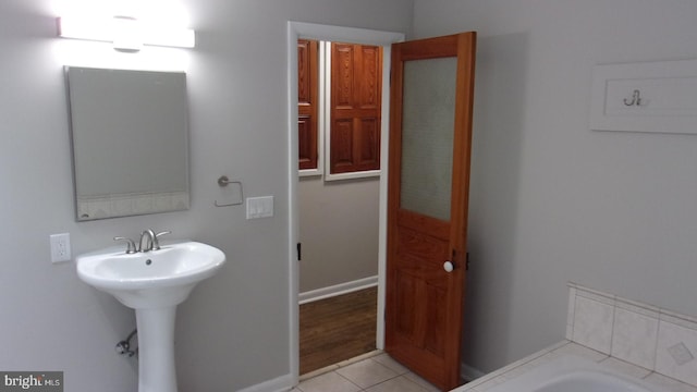 139 N 11th St, Allentown, PA 18102 - bathroom with a bath and tile patterned floors