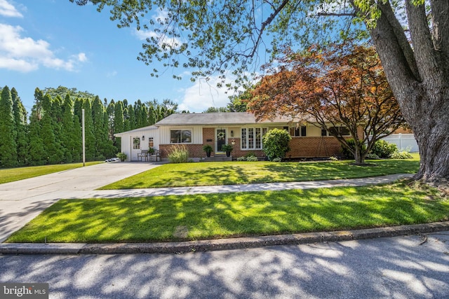 4715 Courtland St, Camp Hill, PA 17011 - ranch-style house featuring driveway, a front yard, and brick siding