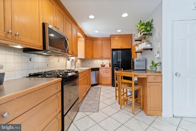4715 Courtland St, Camp Hill, PA 17011 - kitchen featuring black appliances, light tile patterned floors, decorative backsplash, light countertops, and recessed lighting
