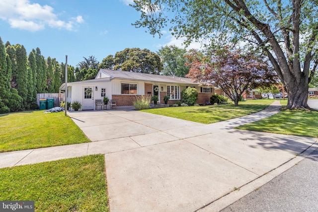 4715 Courtland St, Camp Hill, PA 17011 - ranch-style house featuring driveway, a front lawn, board and batten siding, and brick siding