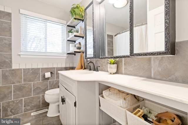 4715 Courtland St, Camp Hill, PA 17011 - bathroom with tile walls, vanity, and tile patterned flooring