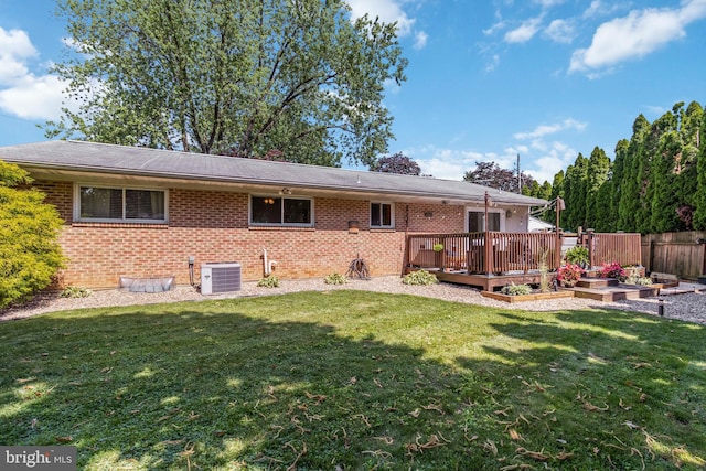 4715 Courtland St, Camp Hill, PA 17011 - back of house featuring brick siding, a deck, and a vegetable garden