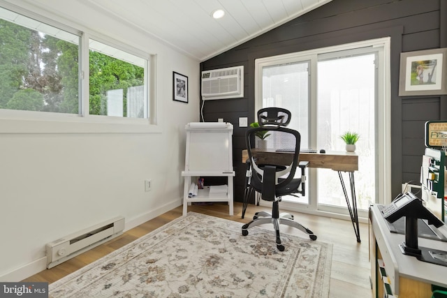 4715 Courtland St, Camp Hill, PA 17011 - office with baseboard heating, vaulted ceiling, a wall mounted air conditioner, plenty of natural light, and wood finished floors