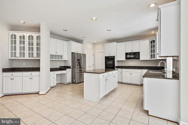 1050 Northfalls Ct, Great Falls, VA 22066 - kitchen featuring black appliances, a kitchen island, recessed lighting, white cabinetry, and glass insert cabinets