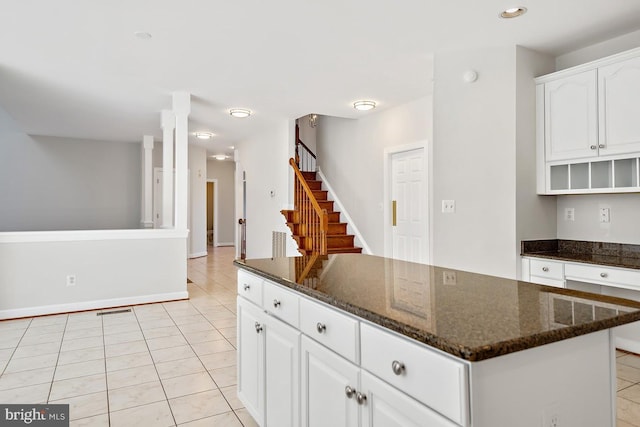 1050 Northfalls Ct, Great Falls, VA 22066 - kitchen with light tile patterned floors, a center island, dark stone countertops, white cabinetry, and recessed lighting