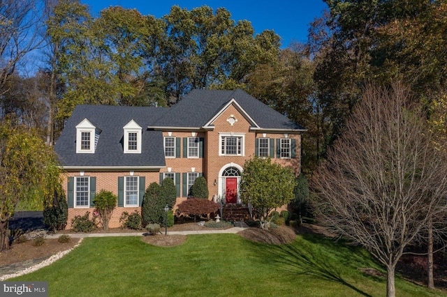 1050 Northfalls Ct, Great Falls, VA 22066 - colonial-style house with brick siding and a front lawn
