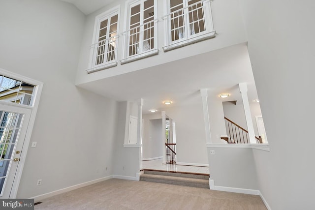 1050 Northfalls Ct, Great Falls, VA 22066 - foyer with carpet, a towering ceiling, and stairs