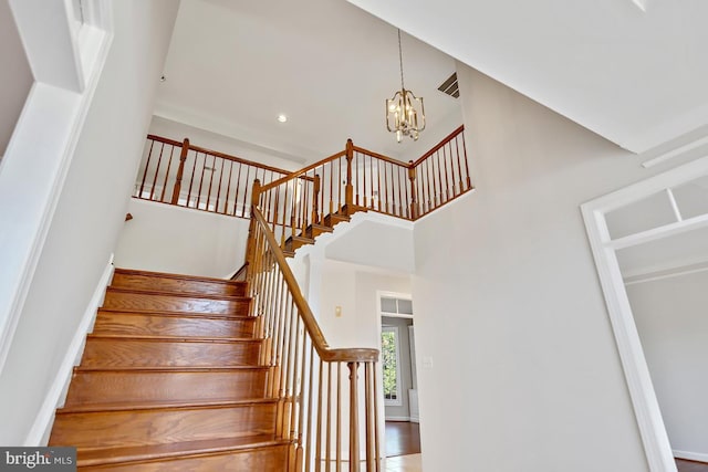 1050 Northfalls Ct, Great Falls, VA 22066 - staircase with a towering ceiling and a chandelier