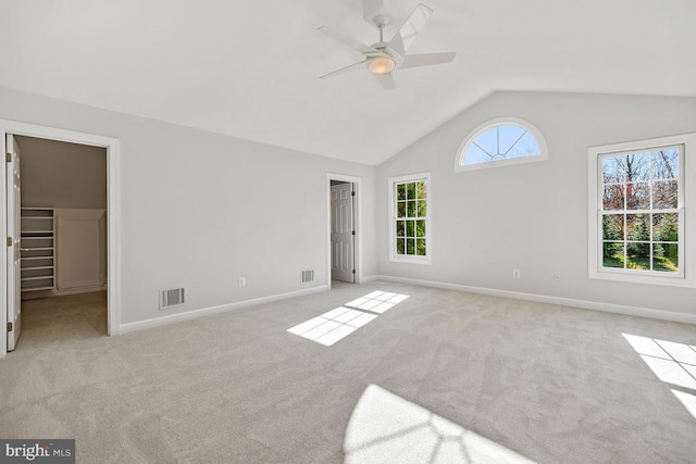 1050 Northfalls Ct, Great Falls, VA 22066 - empty room featuring light carpet, vaulted ceiling, and a ceiling fan