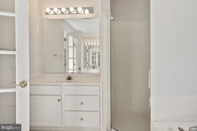 1050 Northfalls Ct, Great Falls, VA 22066 - bathroom featuring vanity, a bath, and tiled shower