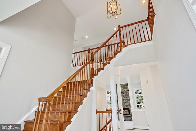1050 Northfalls Ct, Great Falls, VA 22066 - stairway with a towering ceiling, recessed lighting, and a chandelier