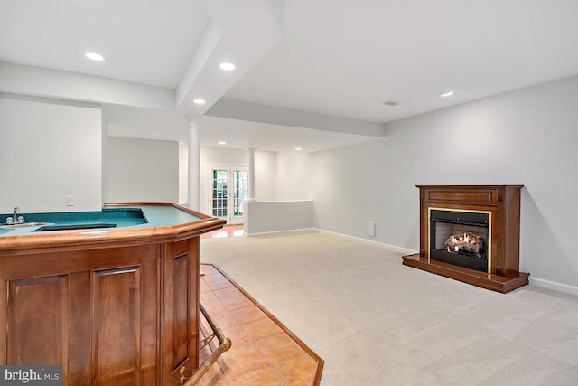 1050 Northfalls Ct, Great Falls, VA 22066 - recreation room featuring recessed lighting, light colored carpet, a lit fireplace, and light tile patterned floors