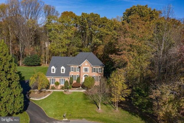 1050 Northfalls Ct, Great Falls, VA 22066 - view of front of house featuring a front yard and a view of trees