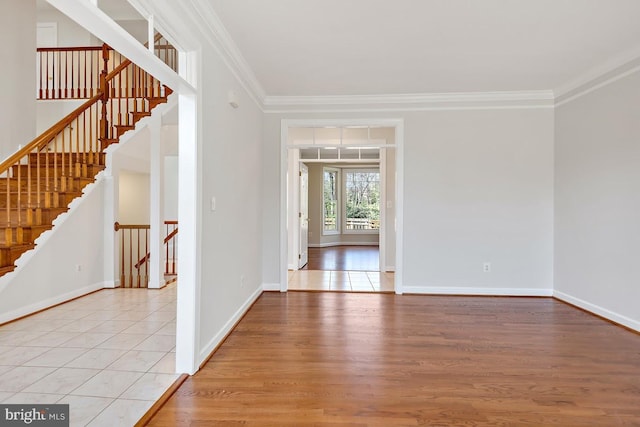 1050 Northfalls Ct, Great Falls, VA 22066 - empty room featuring crown molding, light wood finished floors, and stairs