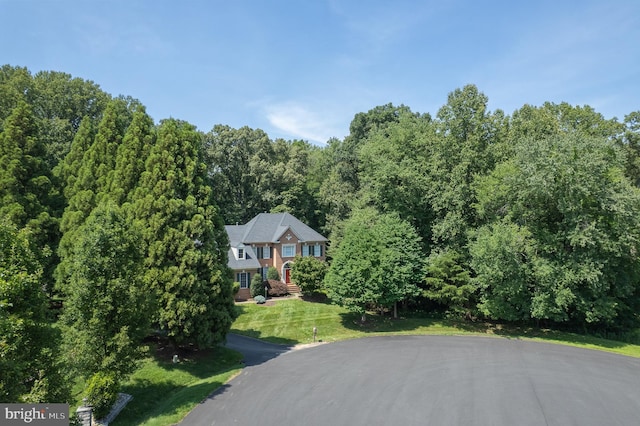 1050 Northfalls Ct, Great Falls, VA 22066 - view of front of property with a front lawn and a wooded view
