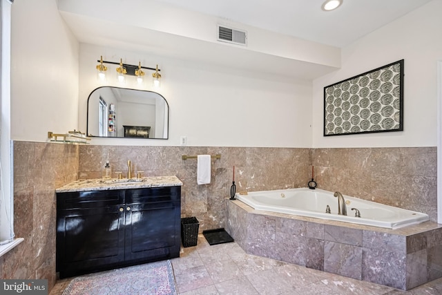 330 W George St, Philadelphia, PA 19123 - bathroom with a bath, vanity, tile walls, and recessed lighting