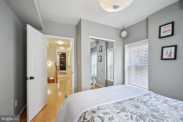 330 W George St, Philadelphia, PA 19123 - bedroom with light wood-style flooring, multiple windows, and a closet