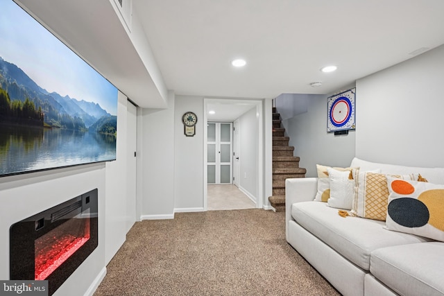330 W George St, Philadelphia, PA 19123 - carpeted living room with stairs, recessed lighting, and a glass covered fireplace