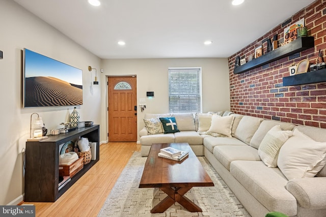 330 W George St, Philadelphia, PA 19123 - living room with wood finished floors, recessed lighting, and brick wall