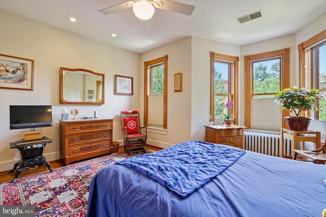 637 Constitution Ave NE, Washington, DC 20002 - bedroom with radiator heating unit, wood finished floors, recessed lighting, and ceiling fan