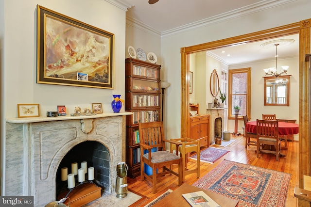 637 Constitution Ave NE, Washington, DC 20002 - living area featuring a fireplace with flush hearth, hardwood / wood-style flooring, ornamental molding, and a chandelier