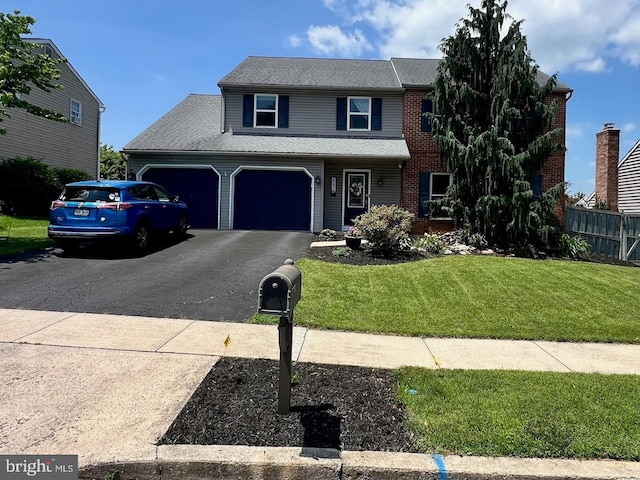 808 Redwood Ave, Reading, PA 19610 - traditional-style house with asphalt driveway and a garage