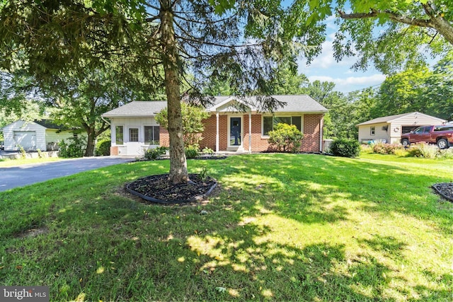 663 Newberry Rd, Middletown, PA 17057 - ranch-style home featuring brick siding, a front yard, and asphalt driveway
