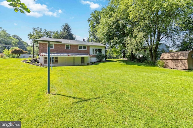 663 Newberry Rd, Middletown, PA 17057 - rear view of property with a storage shed and a lawn