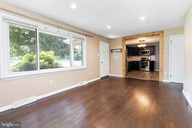 663 Newberry Rd, Middletown, PA 17057 - unfurnished living room featuring dark wood finished floors, recessed lighting, and a chandelier