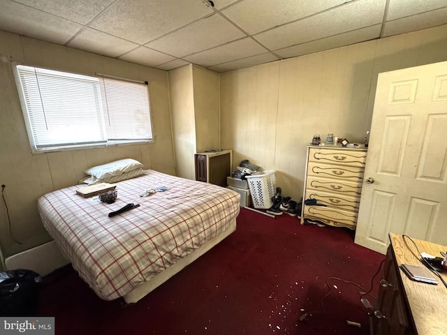 2072 Pickwick St, Philadelphia, PA 19134 - bedroom with a drop ceiling, wooden walls, and dark carpet