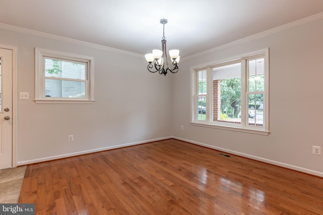 10311 Poe Dr, Manassas, VA 20110 - unfurnished room featuring a chandelier, ornamental molding, and light wood finished floors