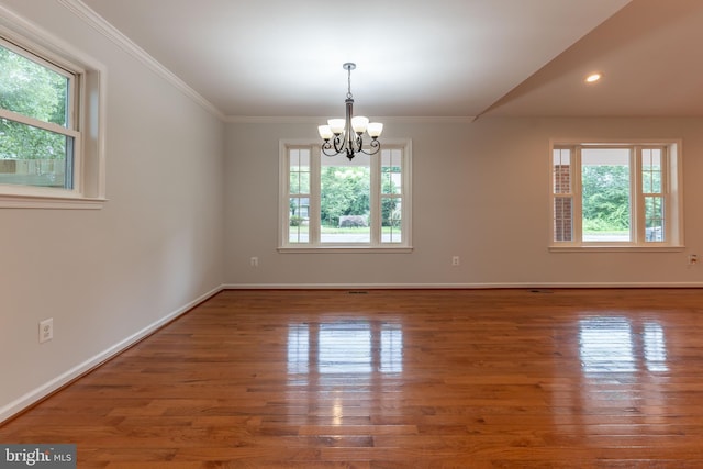 10311 Poe Dr, Manassas, VA 20110 - spare room with plenty of natural light, a chandelier, wood finished floors, crown molding, and recessed lighting