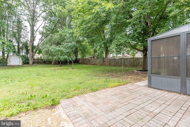 10311 Poe Dr, Manassas, VA 20110 - fenced backyard featuring a storage unit and a patio area