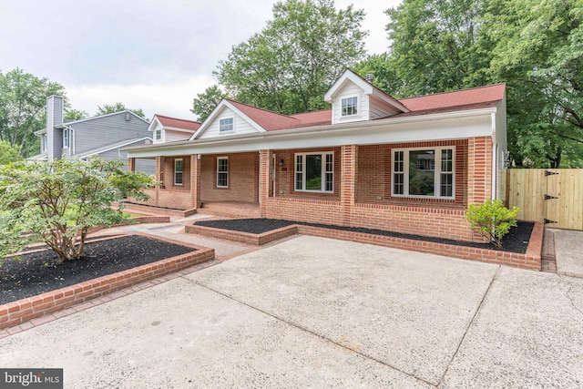 10311 Poe Dr, Manassas, VA 20110 - view of front of house featuring brick siding, a gate, and a porch