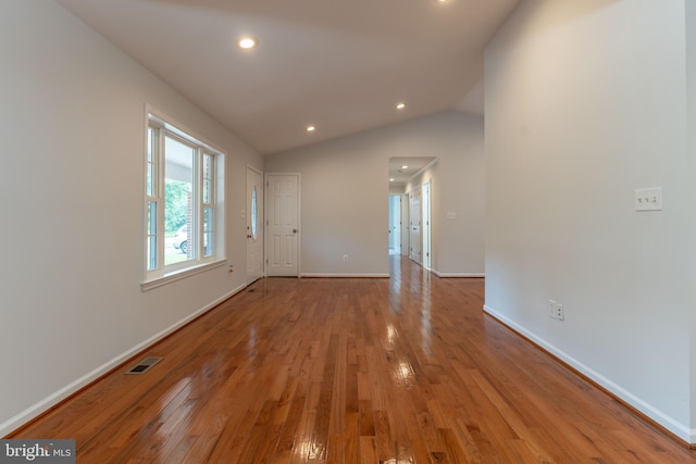 10311 Poe Dr, Manassas, VA 20110 - unfurnished room with wood finished floors, vaulted ceiling, and recessed lighting
