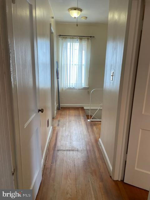 6813 10th Ave, Takoma Park, MD 20912 - hallway featuring wood finished floors and baseboards