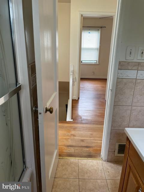 6813 10th Ave, Takoma Park, MD 20912 - bathroom featuring vanity and tile patterned floors