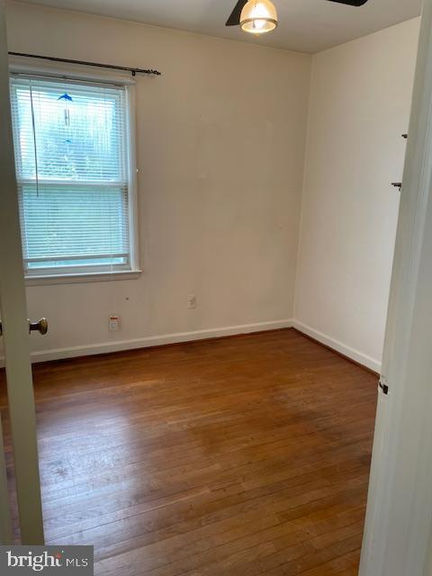 6813 10th Ave, Takoma Park, MD 20912 - empty room featuring wood finished floors and baseboards