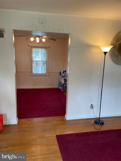 6813 10th Ave, Takoma Park, MD 20912 - corridor featuring light wood finished floors and baseboards
