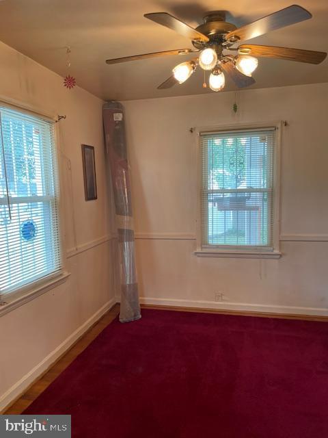 6813 10th Ave, Takoma Park, MD 20912 - carpeted empty room with plenty of natural light and ceiling fan
