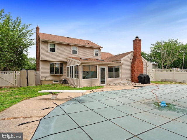 2505 Yellowstone Rd, Cinnaminson, NJ 08077 - back of house featuring a gate, a fenced backyard, a sunroom, and a patio area