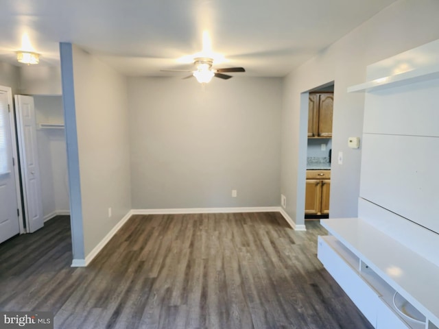9090 Moonshine Holw Unit C, Laurel, MD 20723 - unfurnished living room featuring ceiling fan and dark wood-style floors